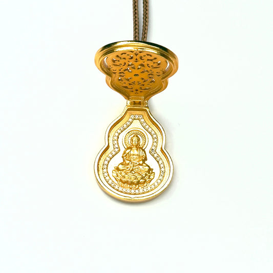 A front open view of the sand gold Hulu gourd charm necklace, revealing a beautifully engraved golden seated Buddha statue framed by a shimmering crystal halo.