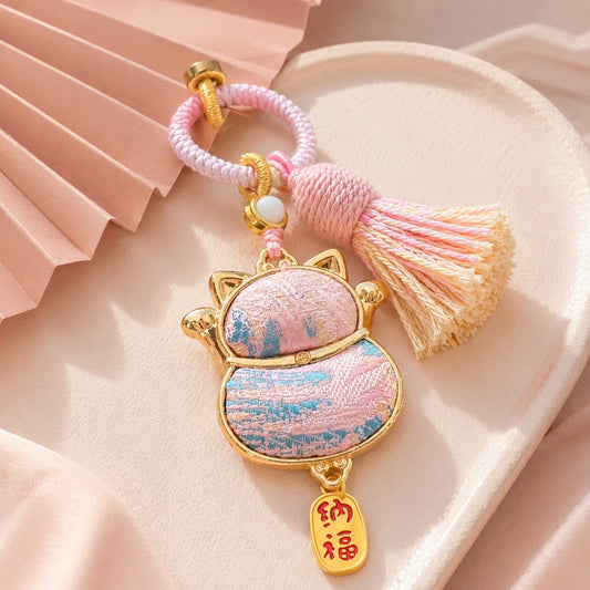 Lucky cat brocade tassel hanging charm in red with gold-tone trim and festive tassel