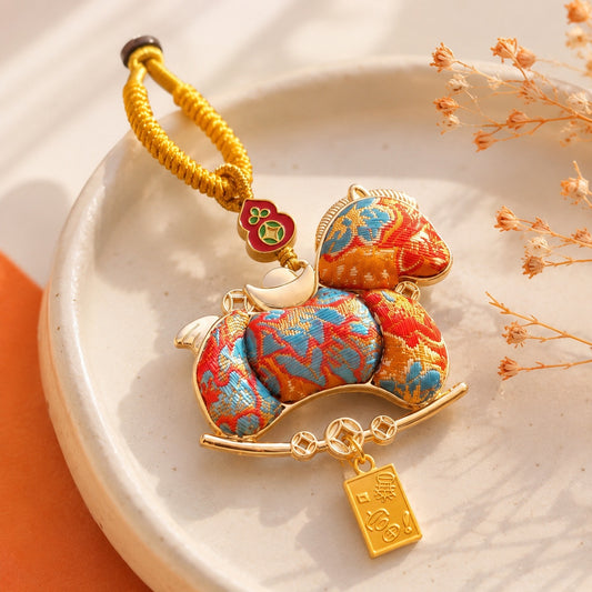 Orange brocade lucky pony hanging charm with gold-tone lucky accents