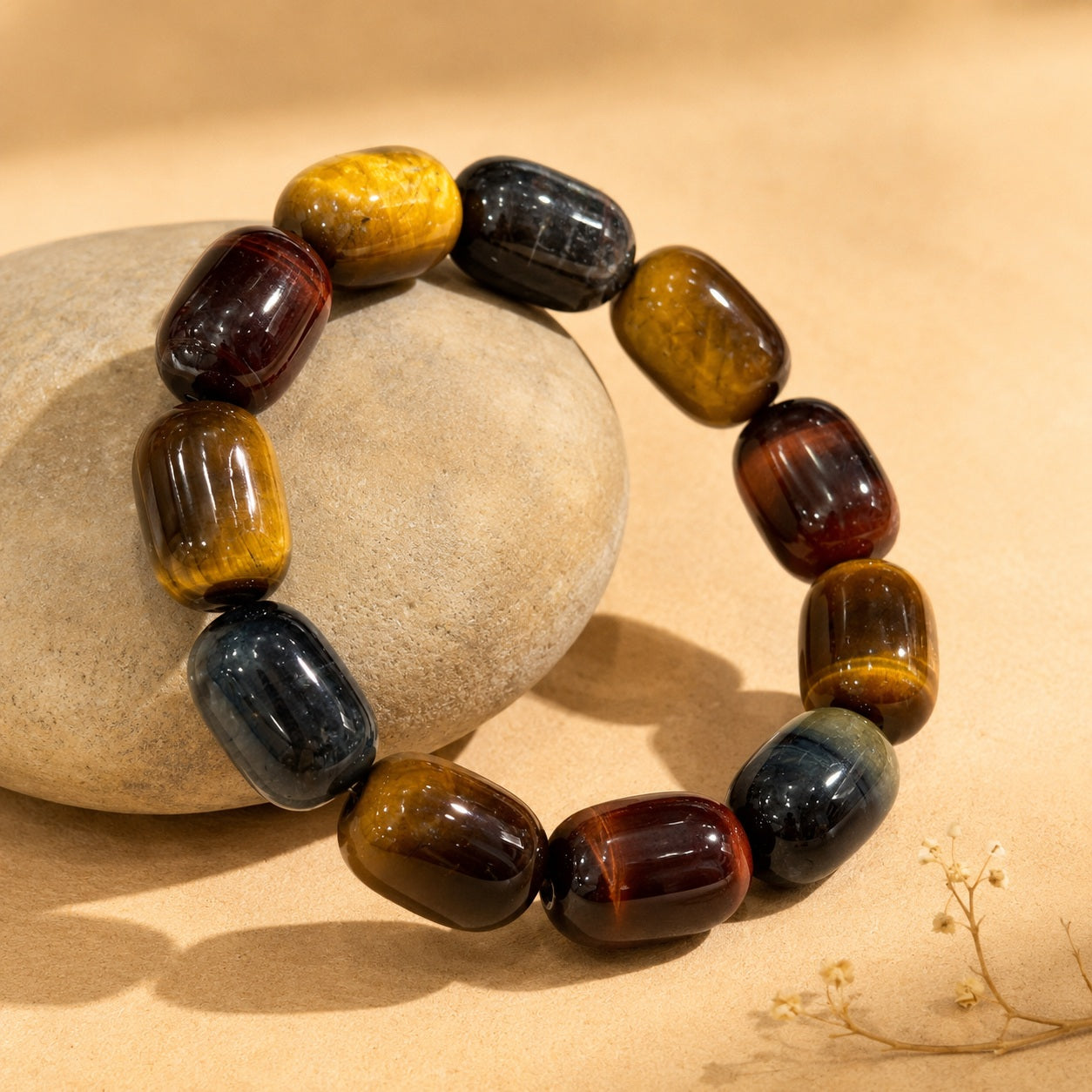 Tricolor tiger’s eye barrel bead bracelet displayed in warm natural light