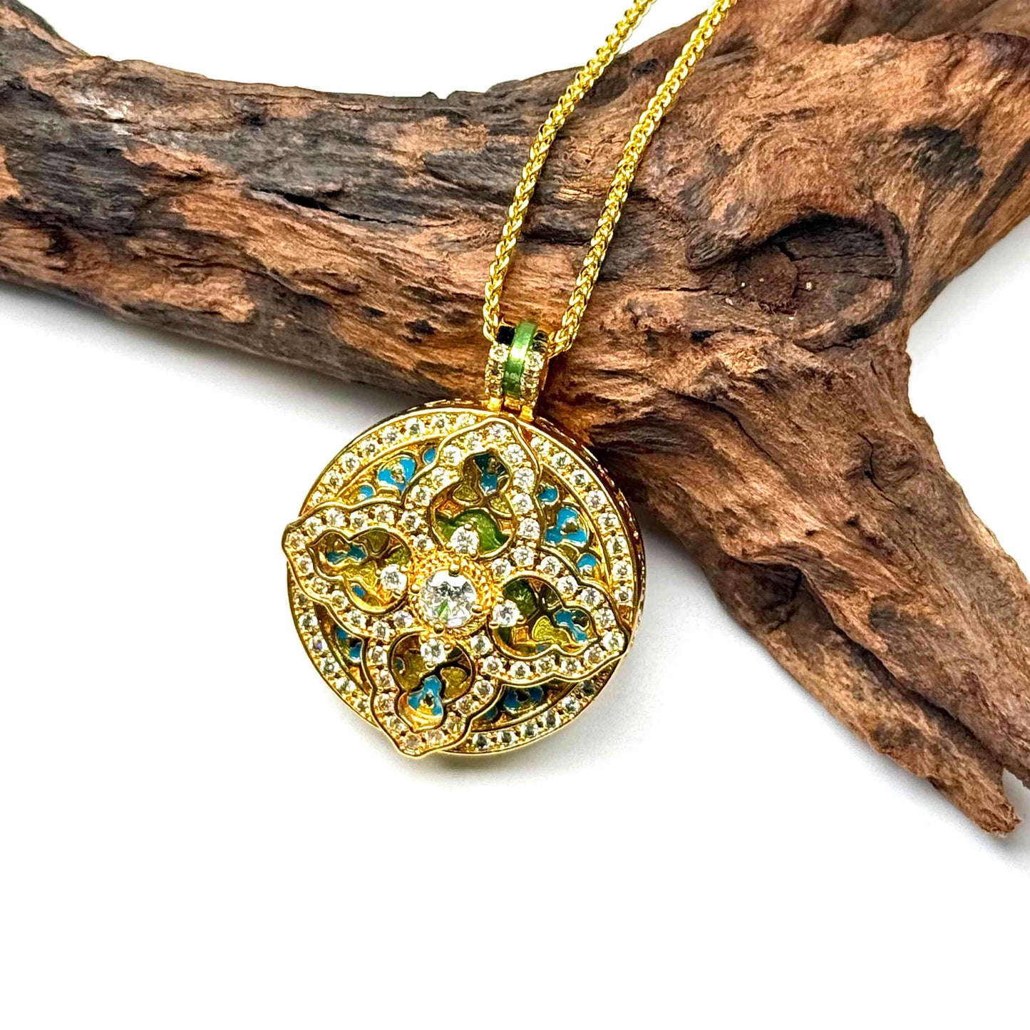 Macro close-up shot of a luxurious gold pavé diamond mandala charm on wood, capturing the precise metal layering, side thickness, and reflective quality of the crystals.