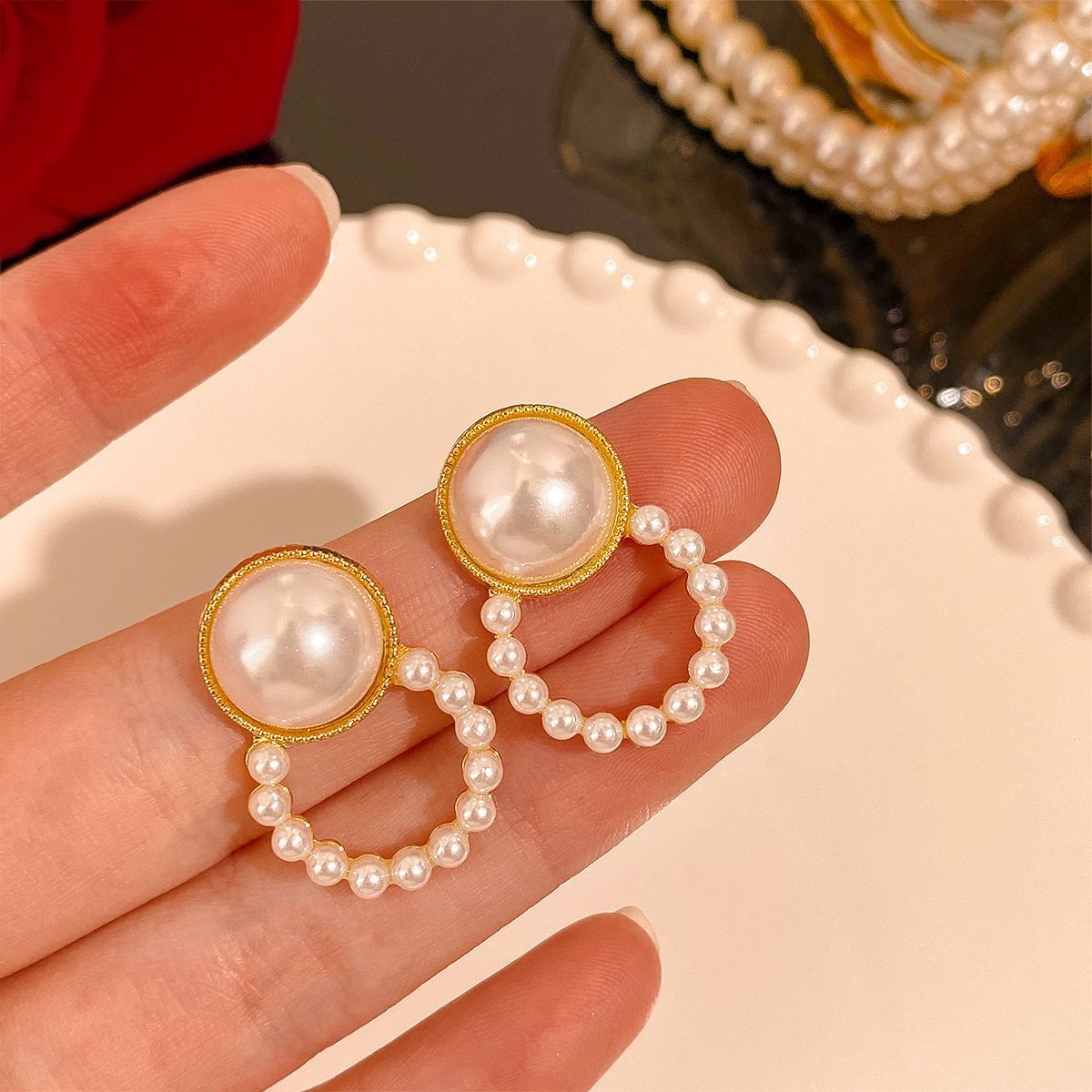 Gold-tone 925 sterling silver circle earrings with simulated pearl accents