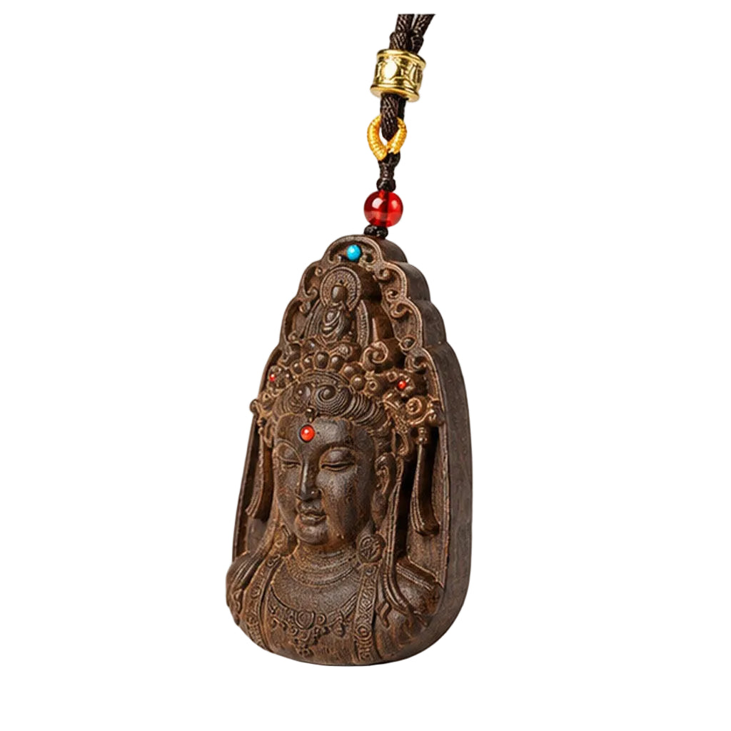 Angled view of detailed agarwood Guanyin carving with red and blue accent beads