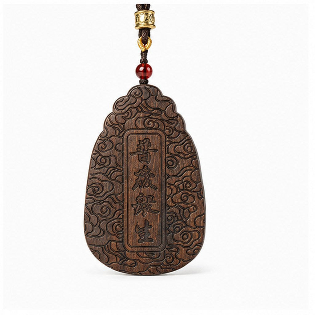 Reverse view of agarwood pendant engraved with the Chinese characters Pudu Zhongsheng