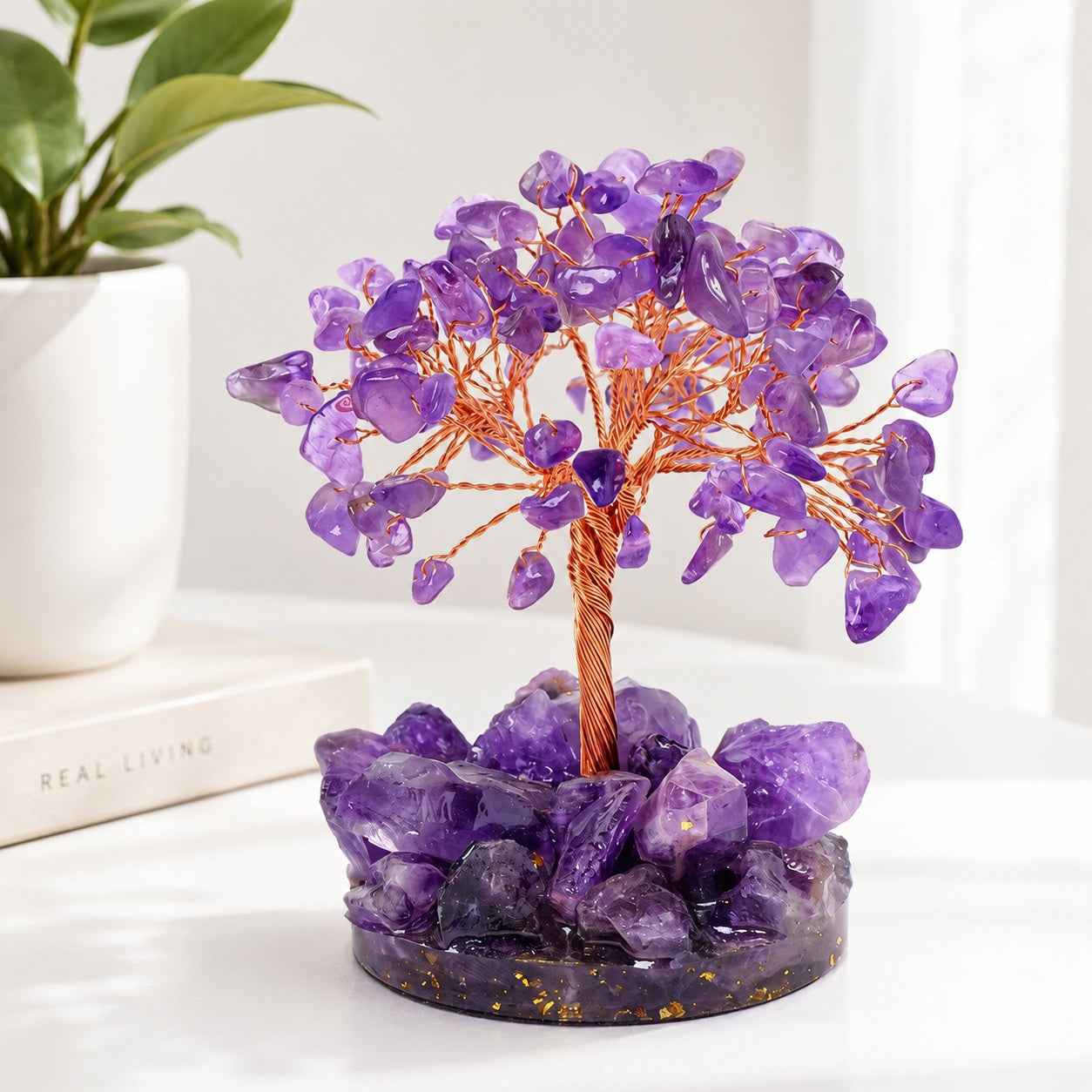 Close-up of amethyst crystal tree decor with copper wire trunk