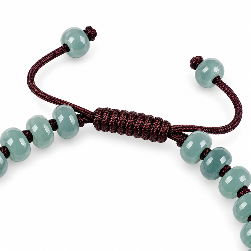 Blue Green Pixiu Rondelle Bracelet - cord and bead detail on white