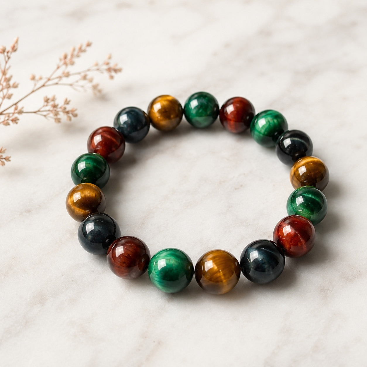 Four-color tiger’s eye beaded bracelet displayed on a light surface