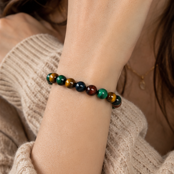 Close-up of a four-color tiger’s eye beaded bracelet worn on the wrist