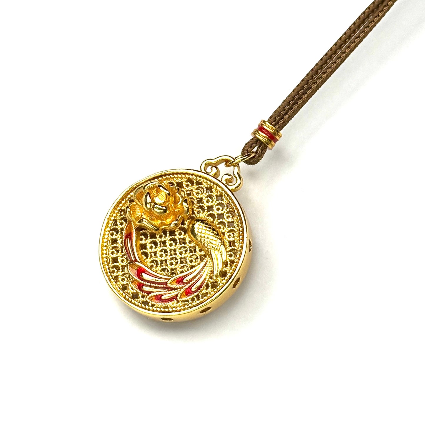 The detailed side-front view of a gold filigree Hulu gourd amulet, highlighting the circular cut-out windows and intricate hollow latticework.