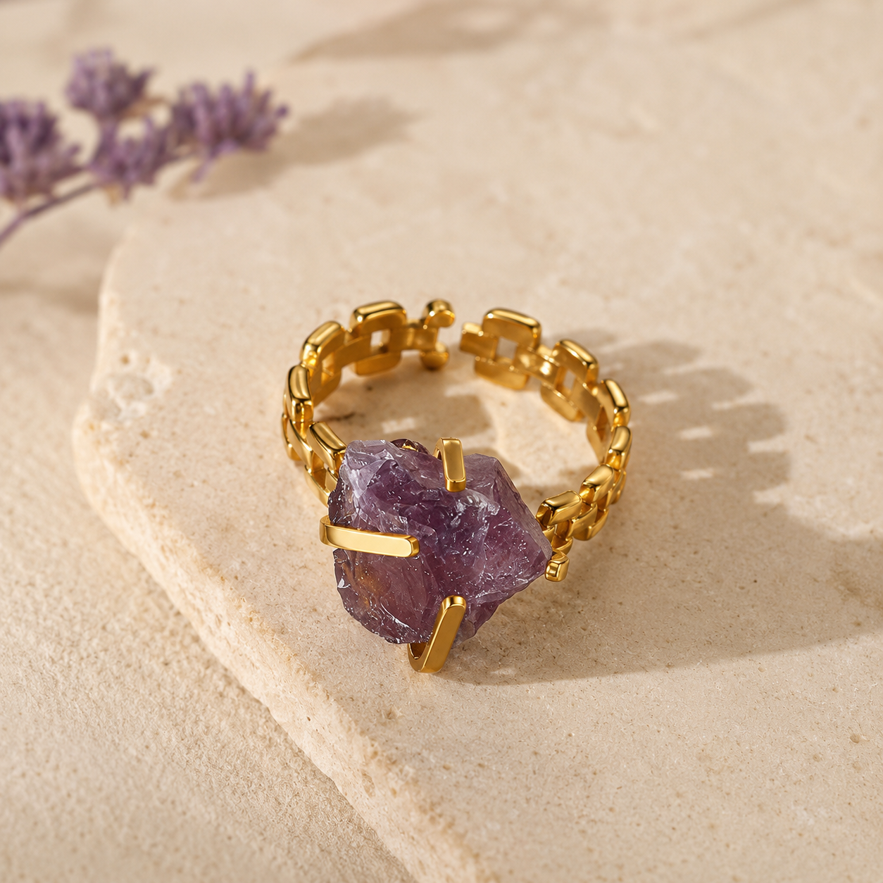 Gold-plated stainless steel statement ring with an irregular purple raw-style stone