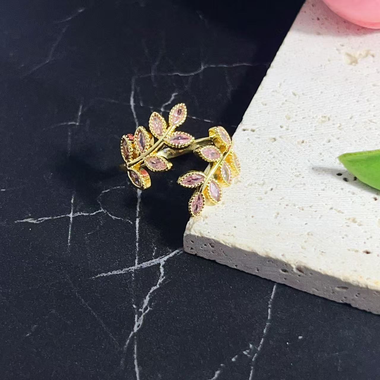 Gold-plated 925 sterling silver adjustable leaf ring with pink stone accents