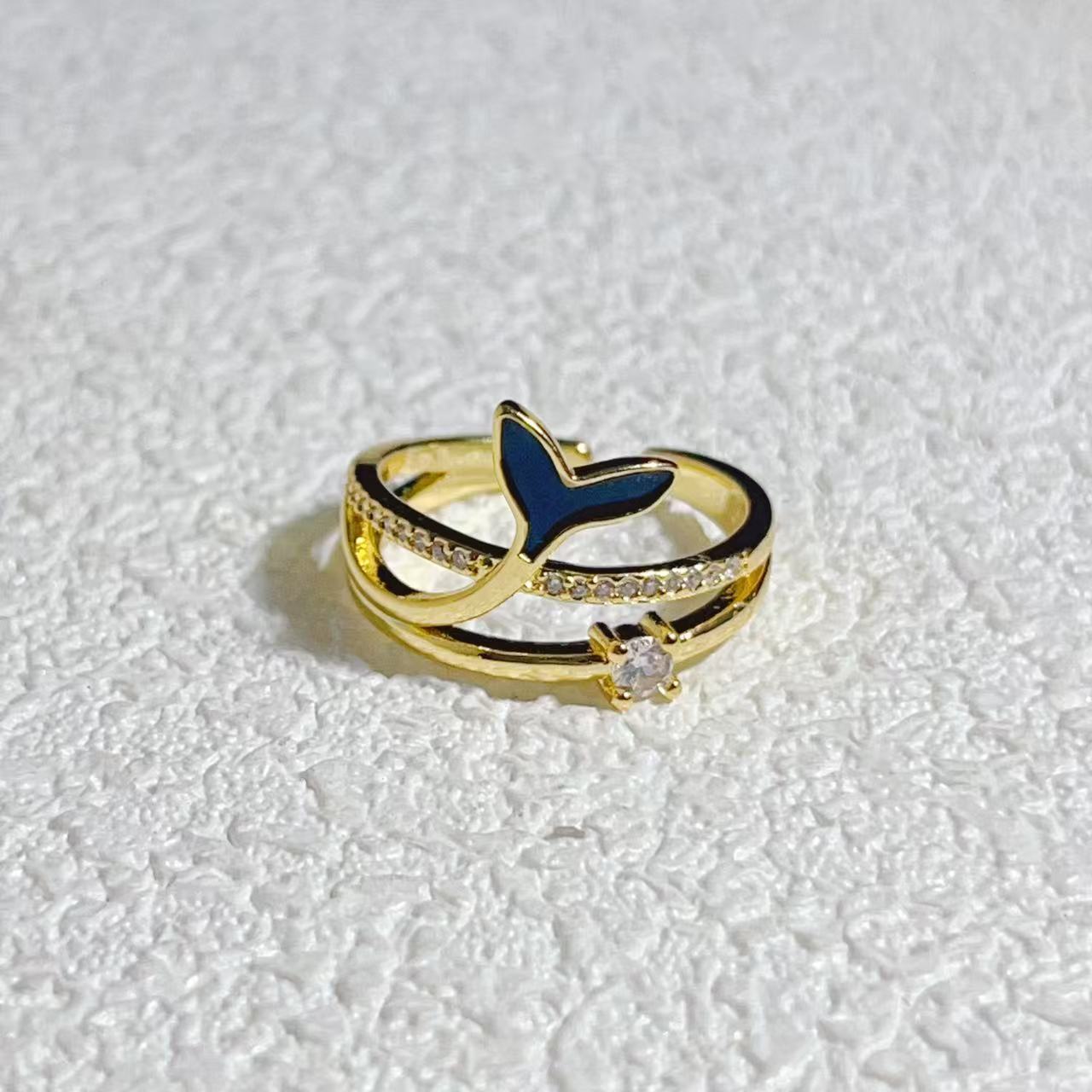 Gold-plated 925 sterling silver whale tail adjustable ring with blue and clear accents