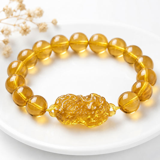 Golden citrine Pixiu beaded bracelet on white tray