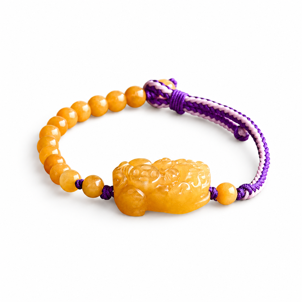 Golden Yellow Pixiu Cord Bracelet - angled view on white