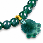 Green Paw Charm Bead Bracelet - centerpiece detail on white