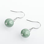 Green Round Bead Drop Earrings — angled view