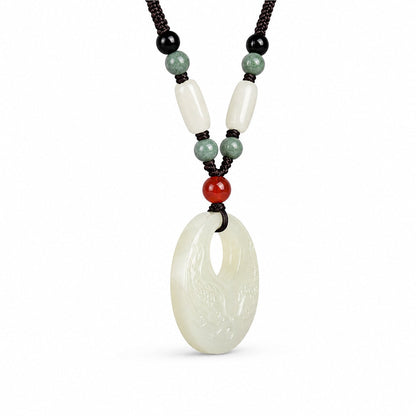 Angled side view showing the thickness of a Hetian jade double fish pendant