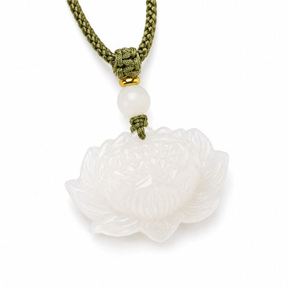 Close-up of white Hetian jade lotus pendant and olive-green braided cord