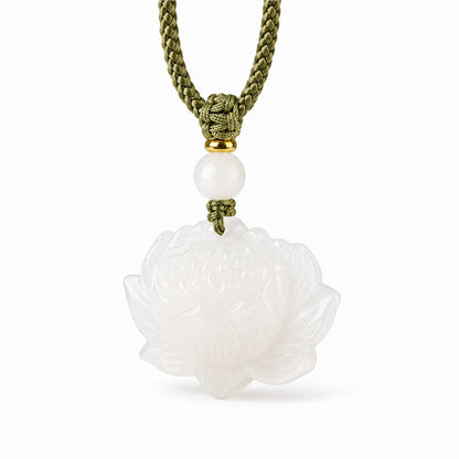 Detail view of carved white Hetian jade lotus pendant with white jade bead