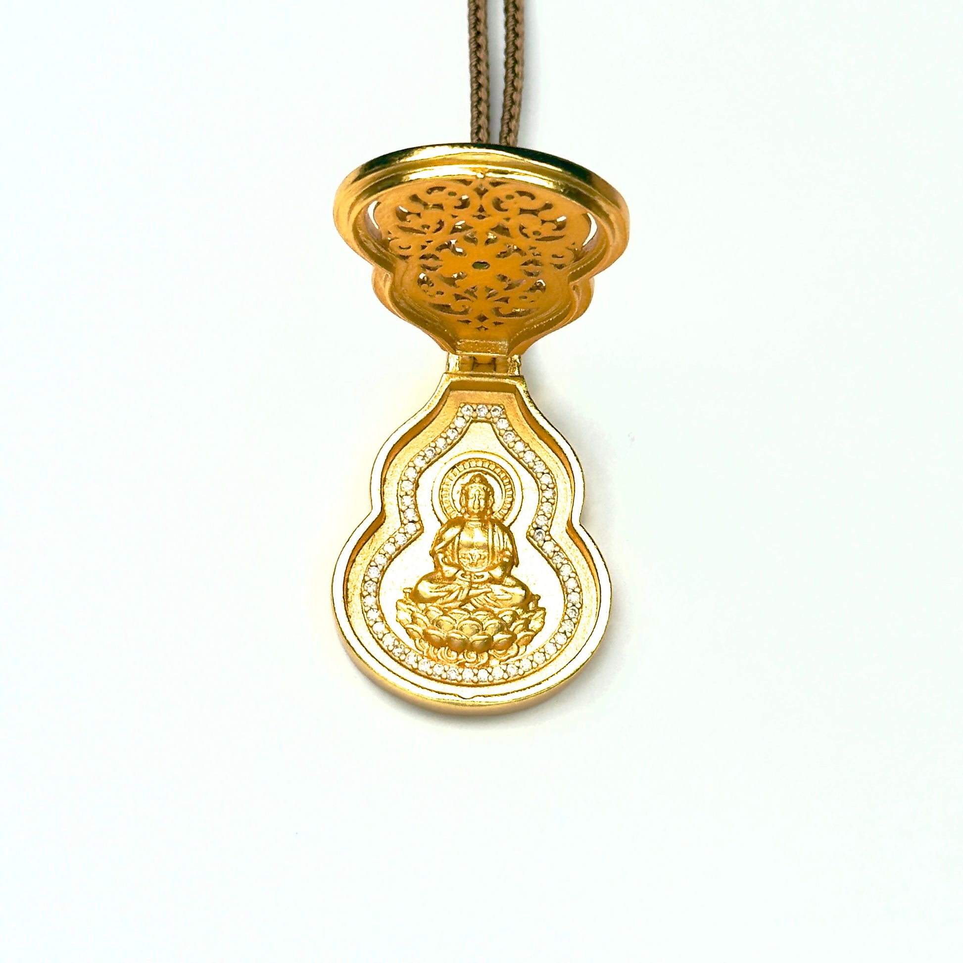 A front open view of the sand gold Hulu gourd charm necklace, revealing a beautifully engraved golden seated Buddha statue framed by a shimmering crystal halo.