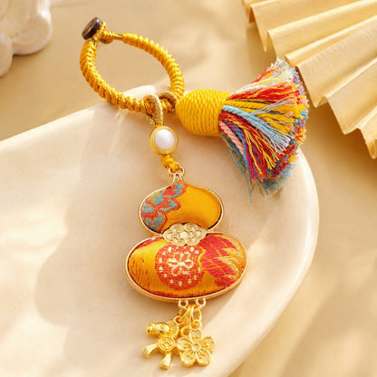 Golden yellow brocade lucky gourd hanging charm with colorful cotton tassel