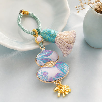 Light blue brocade lucky gourd hanging charm with cotton tassel and gold-tone details