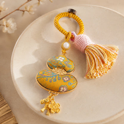 Mustard gold brocade lucky gourd hanging charm with cotton tassel and decorative charms