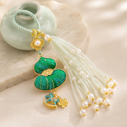 Green brocade lucky gourd hanging charm with pearl tassel and decorative gold charms