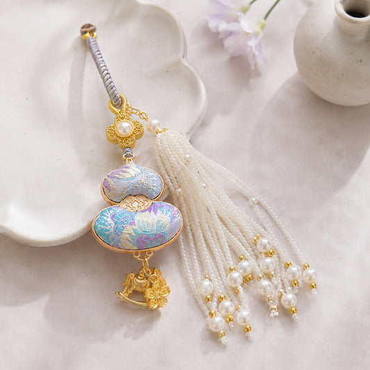 Light blue brocade lucky gourd hanging charm with pearl tassel and gold-tone accents
