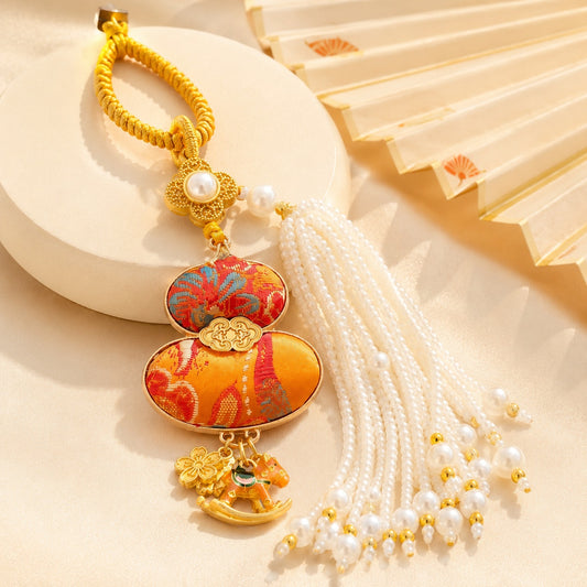 Orange brocade lucky gourd hanging charm with white pearl tassel and rocking horse charms
