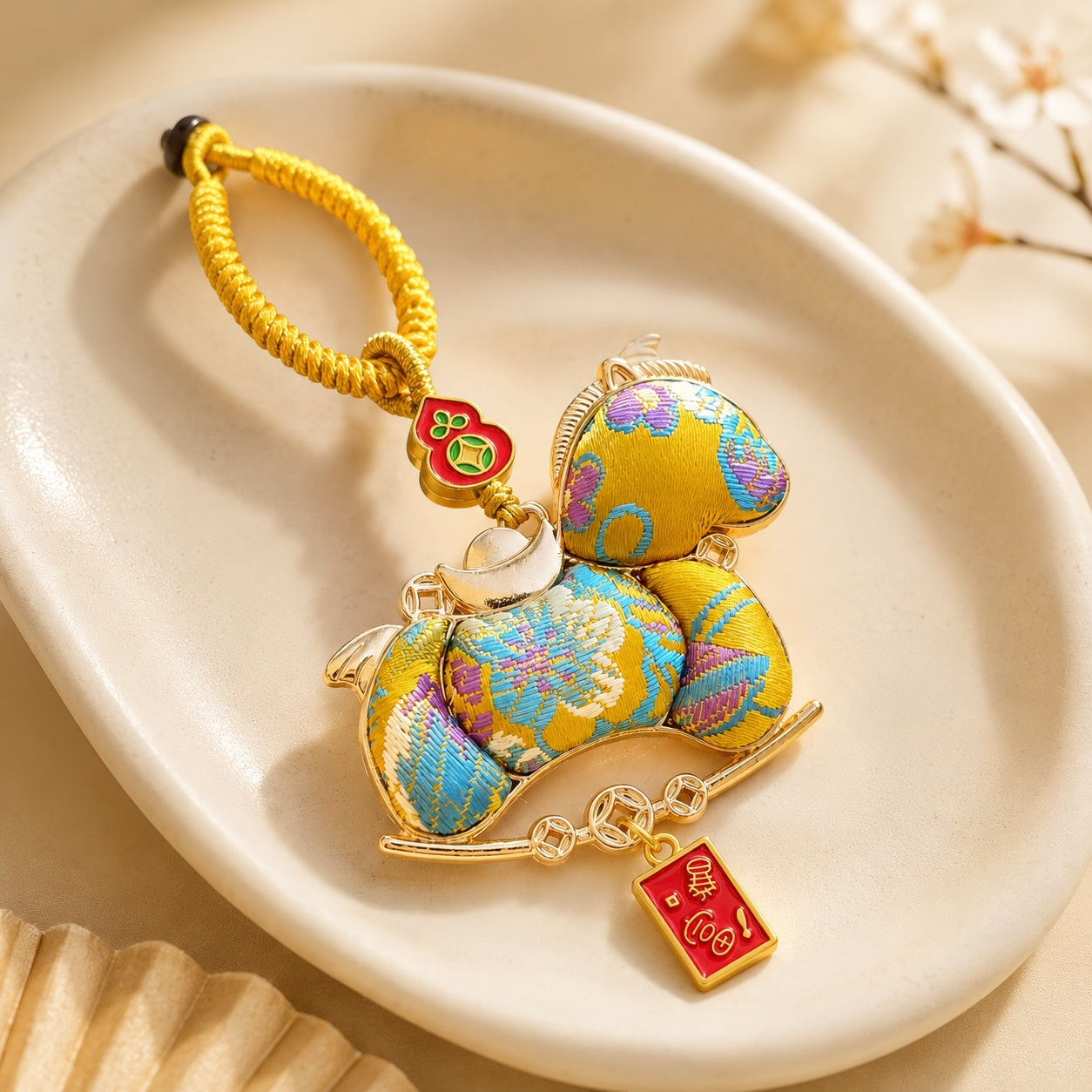 Golden yellow lucky pony brocade hanging charm with fortune tag and ingot details
