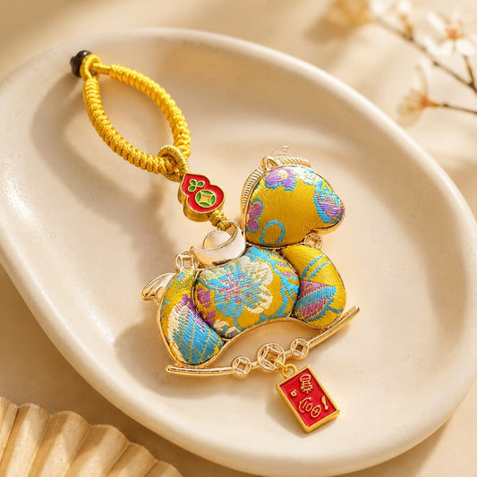 Golden yellow lucky pony brocade hanging charm with fortune tag and ingot details