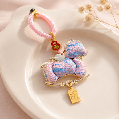 Pink lucky pony brocade bag charm featuring fortune symbols and decorative fabric
