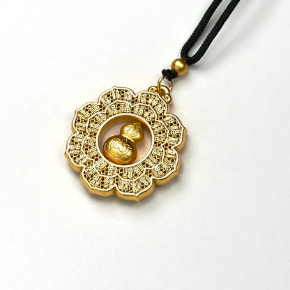 An angled studio view of a luxurious matte gold hundred-Fu blessings talisman, highlighting the precision Chinese calligraphy carving and smooth texture.