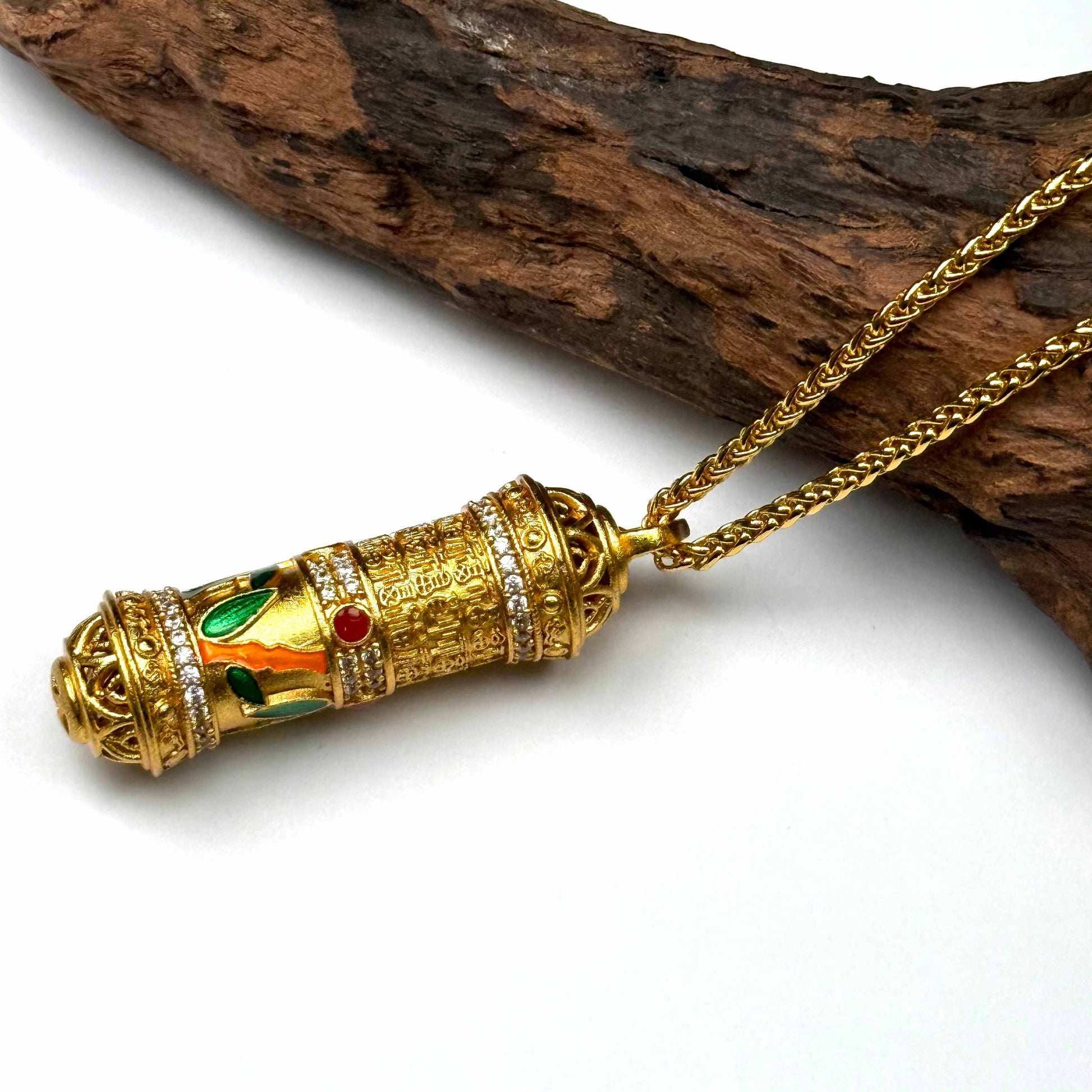 A luxurious sand gold mantra meditation amulet pendant with crystal bands resting elegantly on natural driftwood for a high-end Zen look.