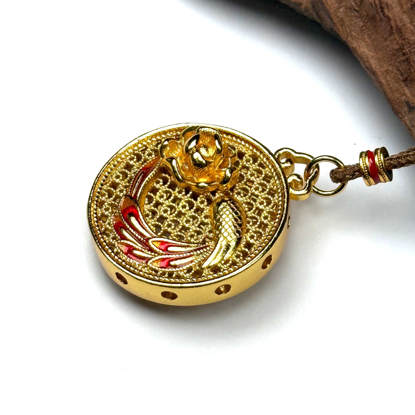 A luxurious sand gold Hulu abundance gourd pendant with a 3D hollow orb structure resting elegantly on natural rustic wood for a Zen look.