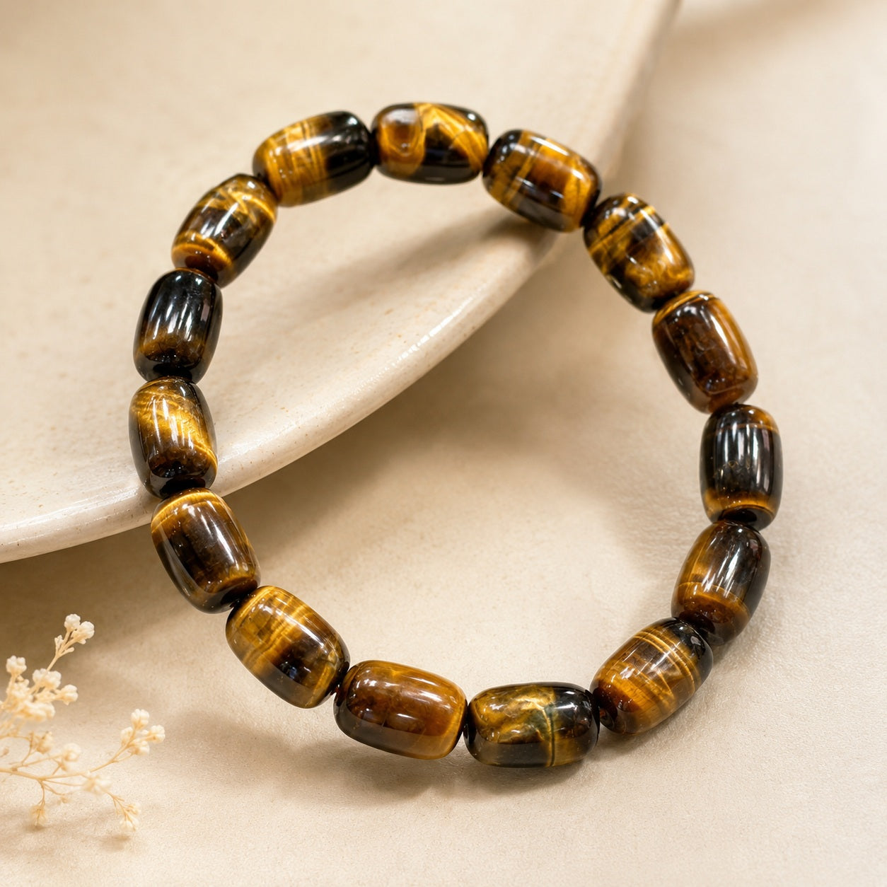 Polished tiger’s eye barrel bead bracelet with golden-brown sheen