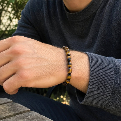 Man wearing natural tiger’s eye barrel bead bracelet