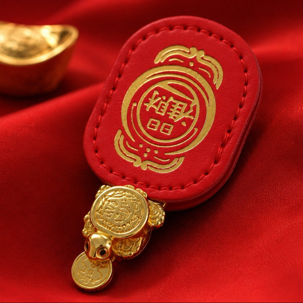 Money-Biting Turtle Feng Shui lucky charm with red backing on red satin