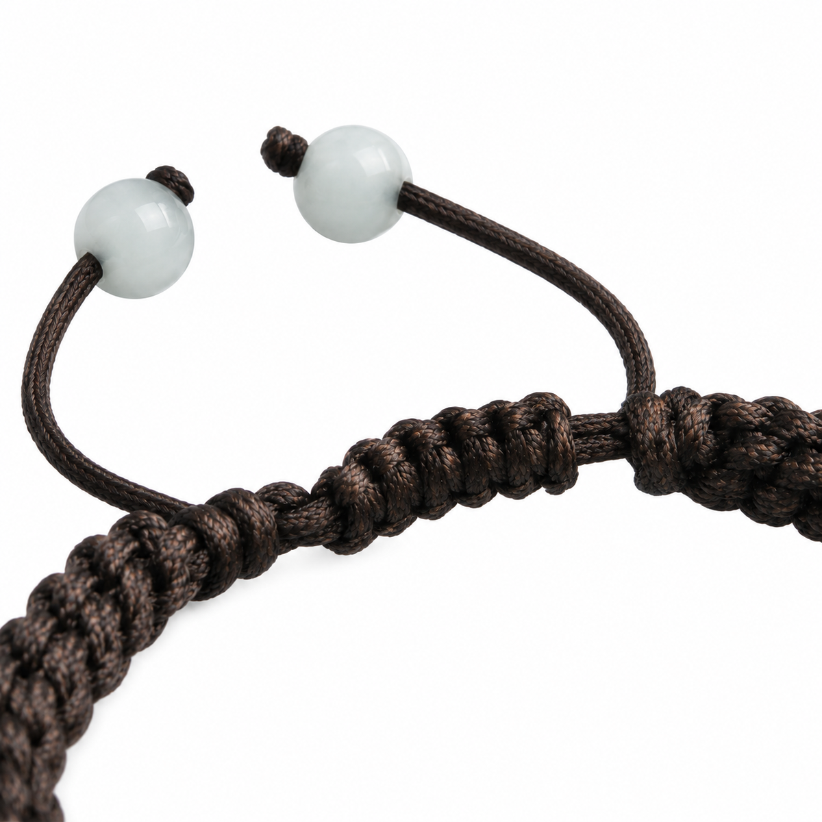 Pale Carved Bar Braided Bracelet - cord and bead detail on white