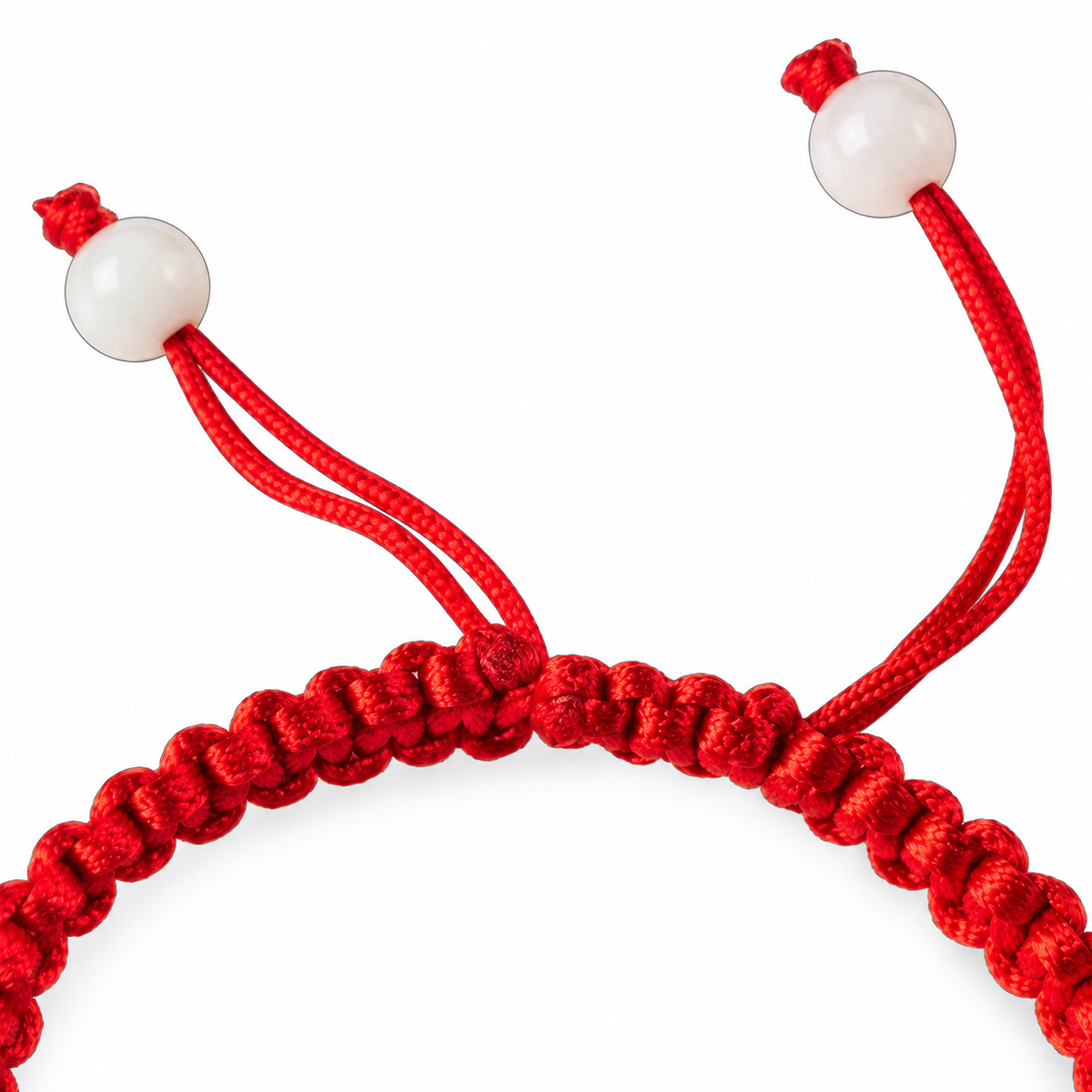 Pale Ring Red Cord Bracelet - cord and bead detail on white