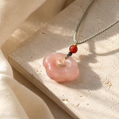 Pink quartzite jade auspicious cloud pendant with red bead and gray cord