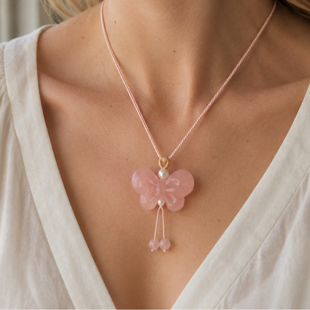 Woman wearing a pink butterfly quartzite jade pendant necklace