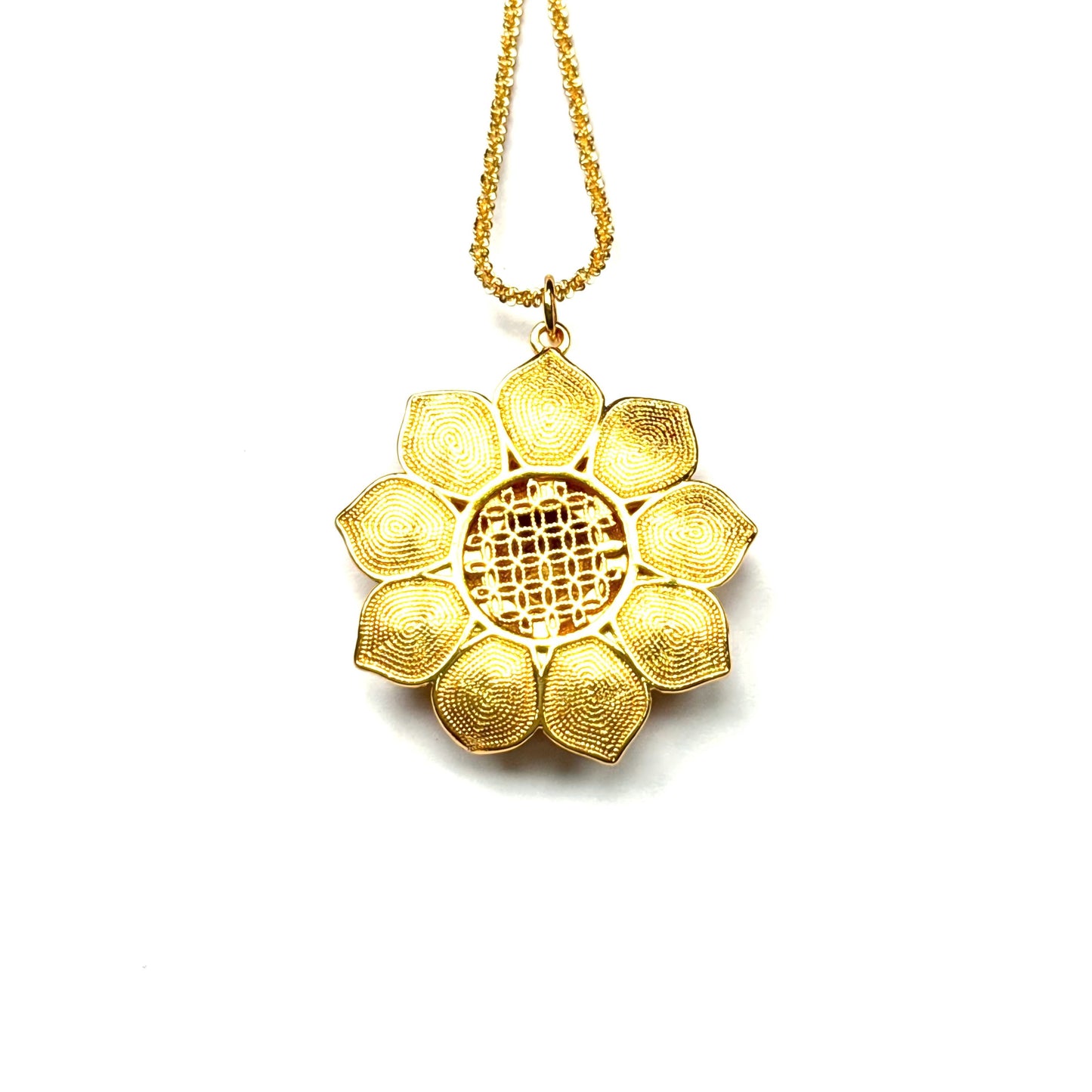 The reversible back side of a sand gold lotus necklace, showcasing an incredibly detailed all-gold filigree wirework mandala design on a pure white background.