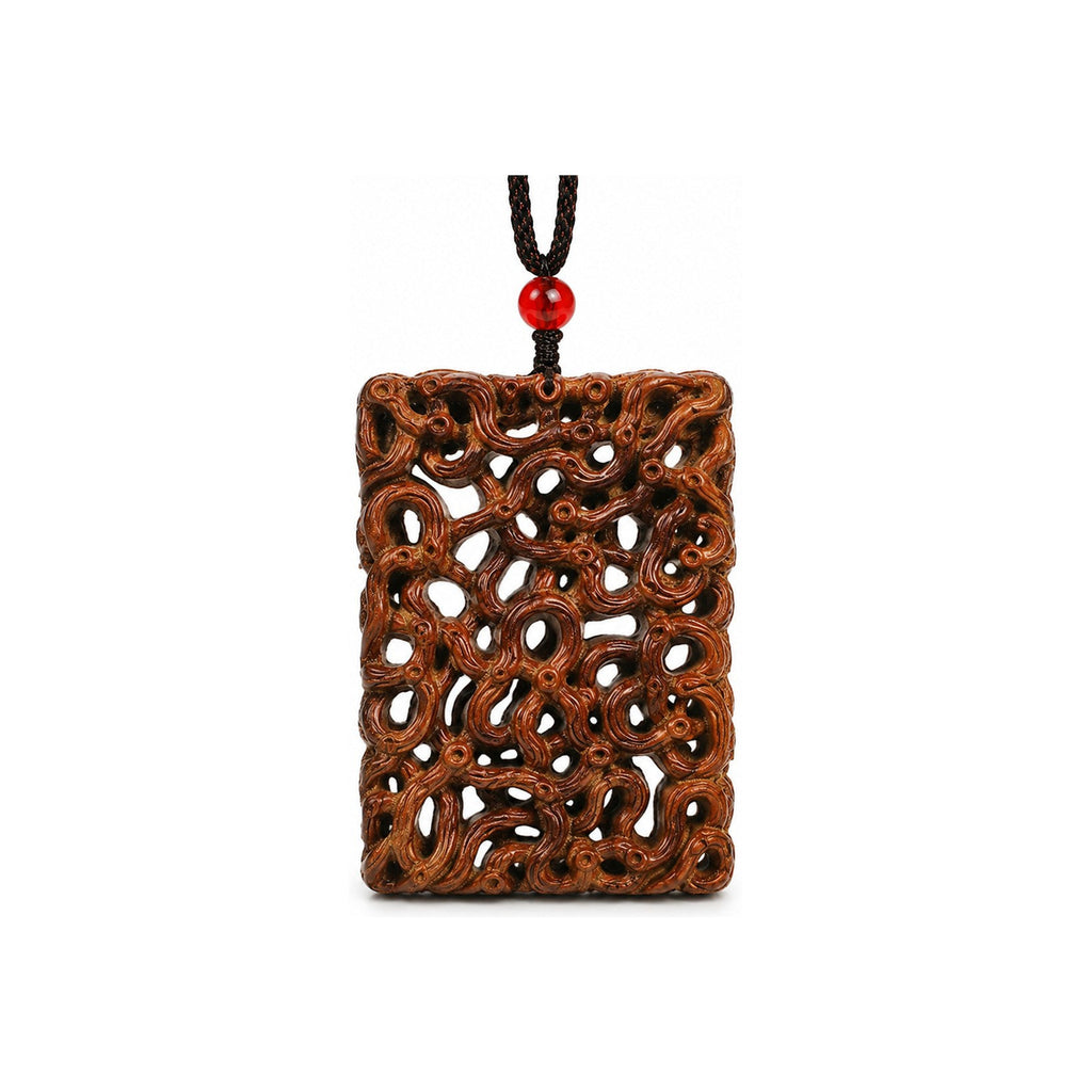 Front view of an openwork jujube wood dragon carving pendant with black braided cord