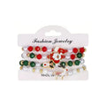 Classic Character Mix — Christmas charm bracelet four-piece set, overhead view on white