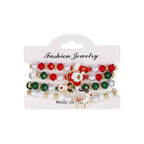 Classic Character Mix — Christmas charm bracelet four-piece set, overhead view on white
