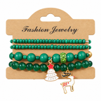 Green Tree & Reindeer — Christmas charm bracelet four-piece set, overhead view on white