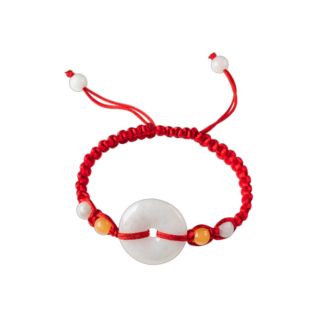 Pale Ring Red Cord Bracelet - overhead view on white
