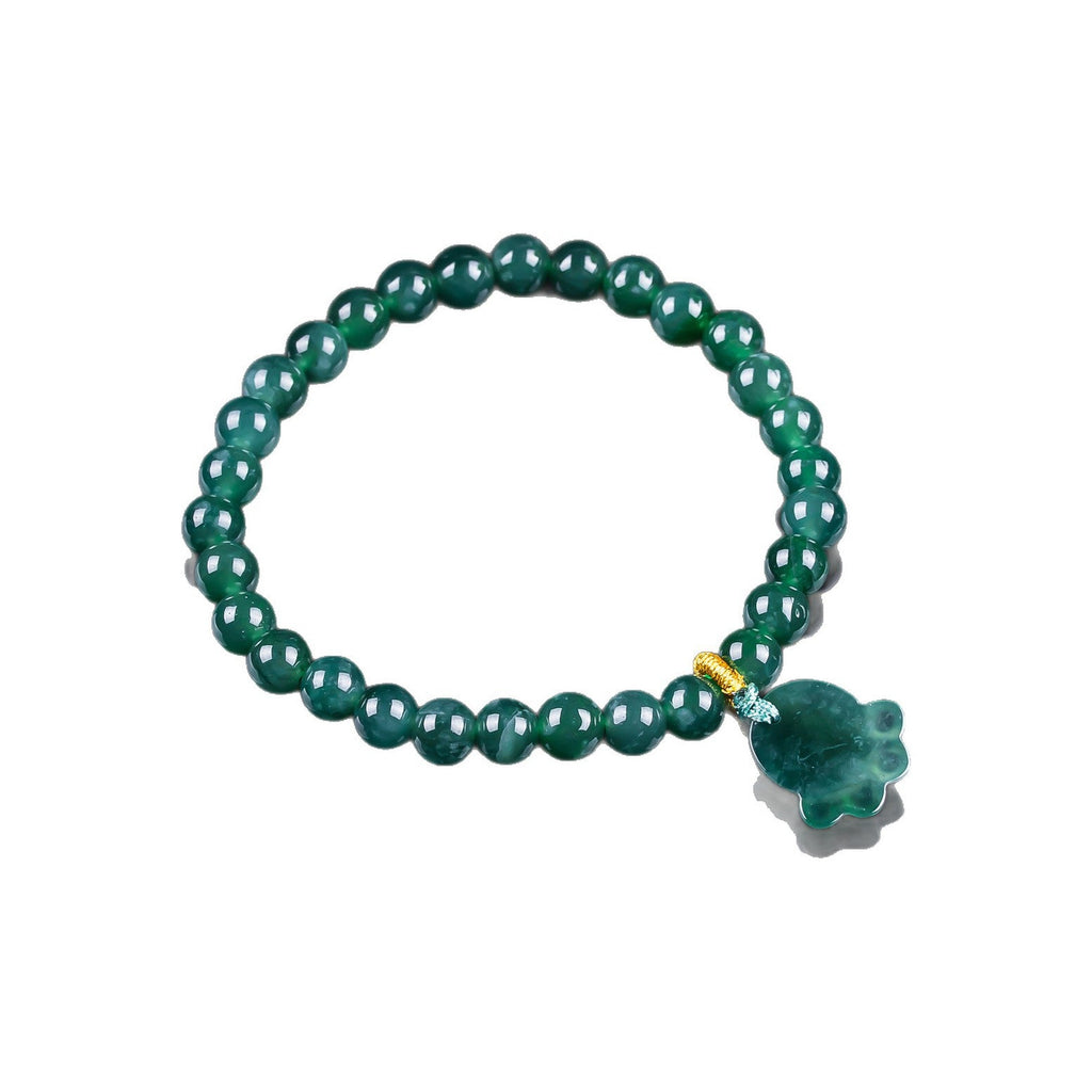 Green Paw Charm Bead Bracelet - overhead view on white